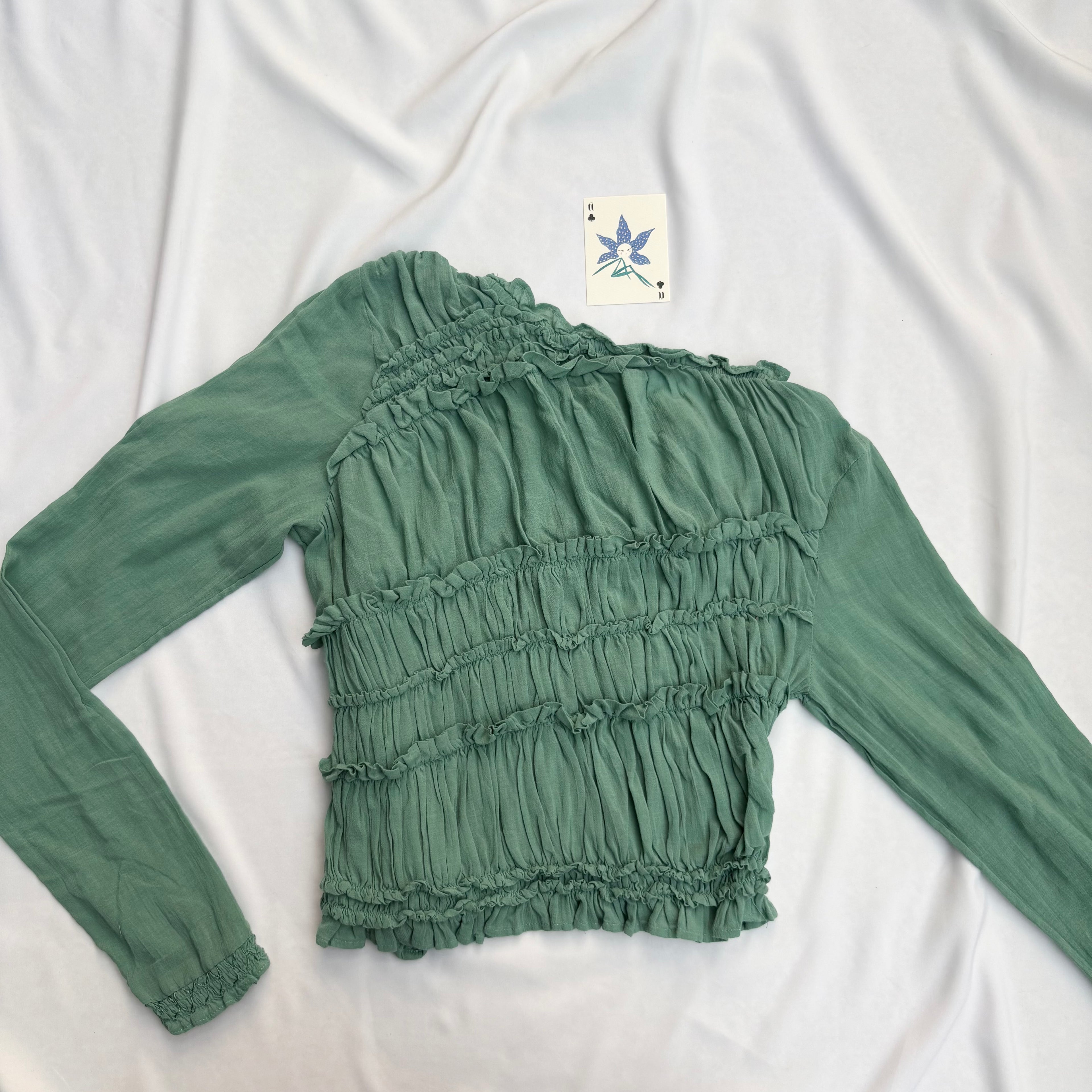 GREEN ASYMMETRIC RUFFLE TOP FROM FREE PEOPLE
