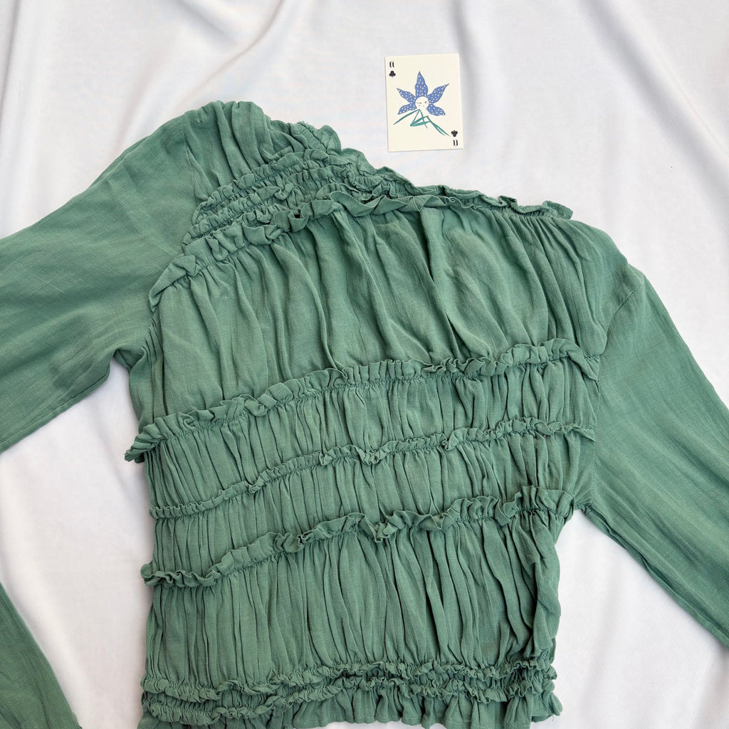 GREEN ASYMMETRIC RUFFLE TOP FROM FREE PEOPLE